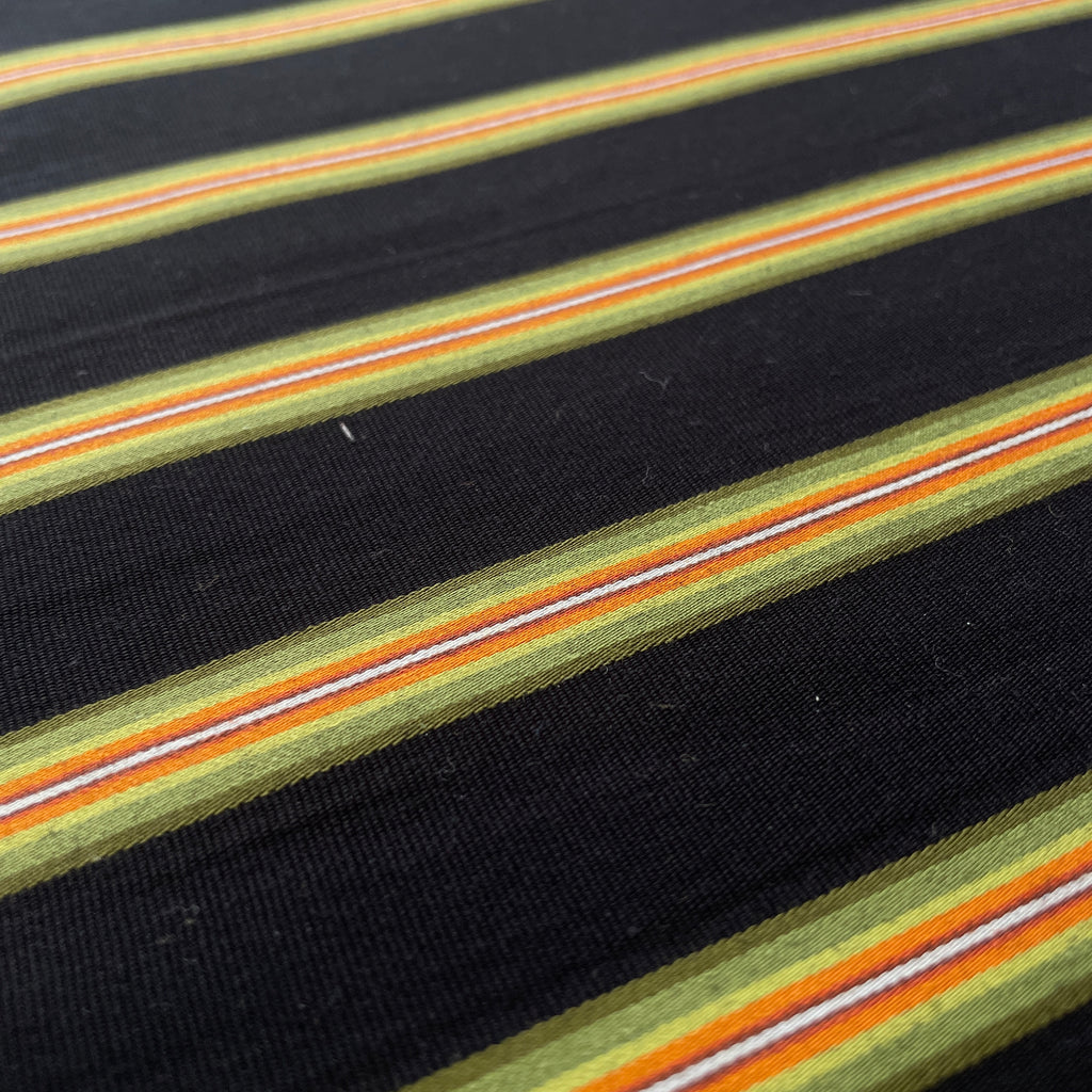 Close-up of striped fabric with black background