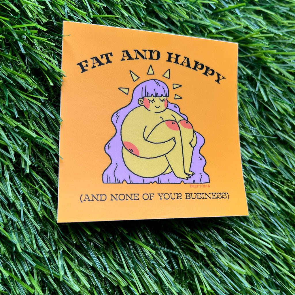 Card with illustration of a person and text 'Fat and Happy (and none of your business)' on grass.