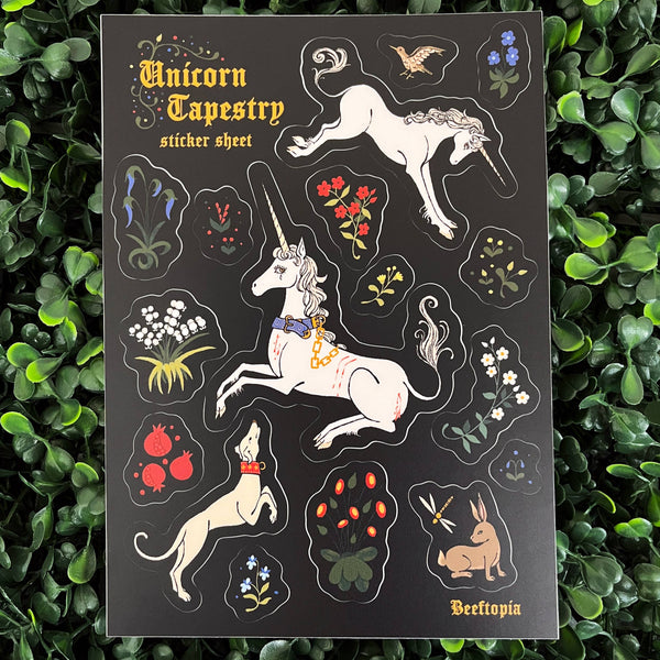 Unicorn-themed tapestry sticker sheet on a green leafy background