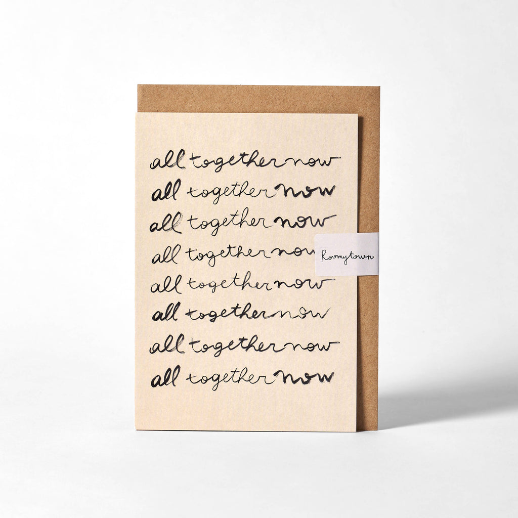 Card with 'all together now' text and Kraft paper border on a white background