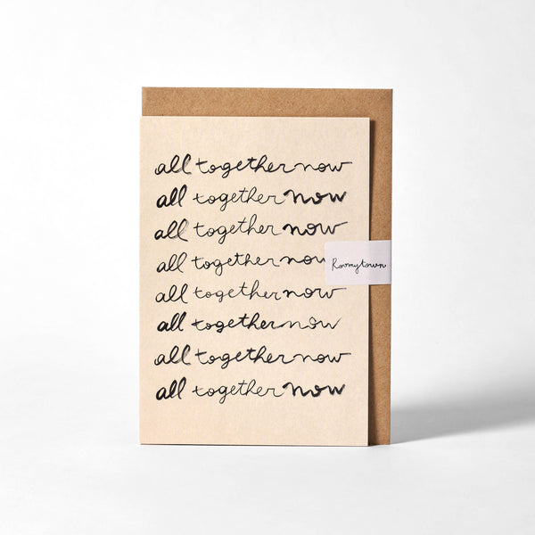 Card with 'all together now' text and Kraft paper border on a white background